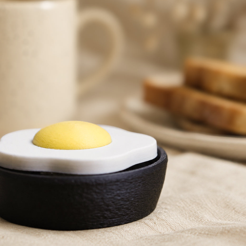 Fried Egg Clicker pocket comfort object — front view