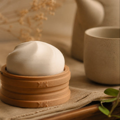 Bao Bun Clicker pocket comfort object — cozy desk lifestyle photo