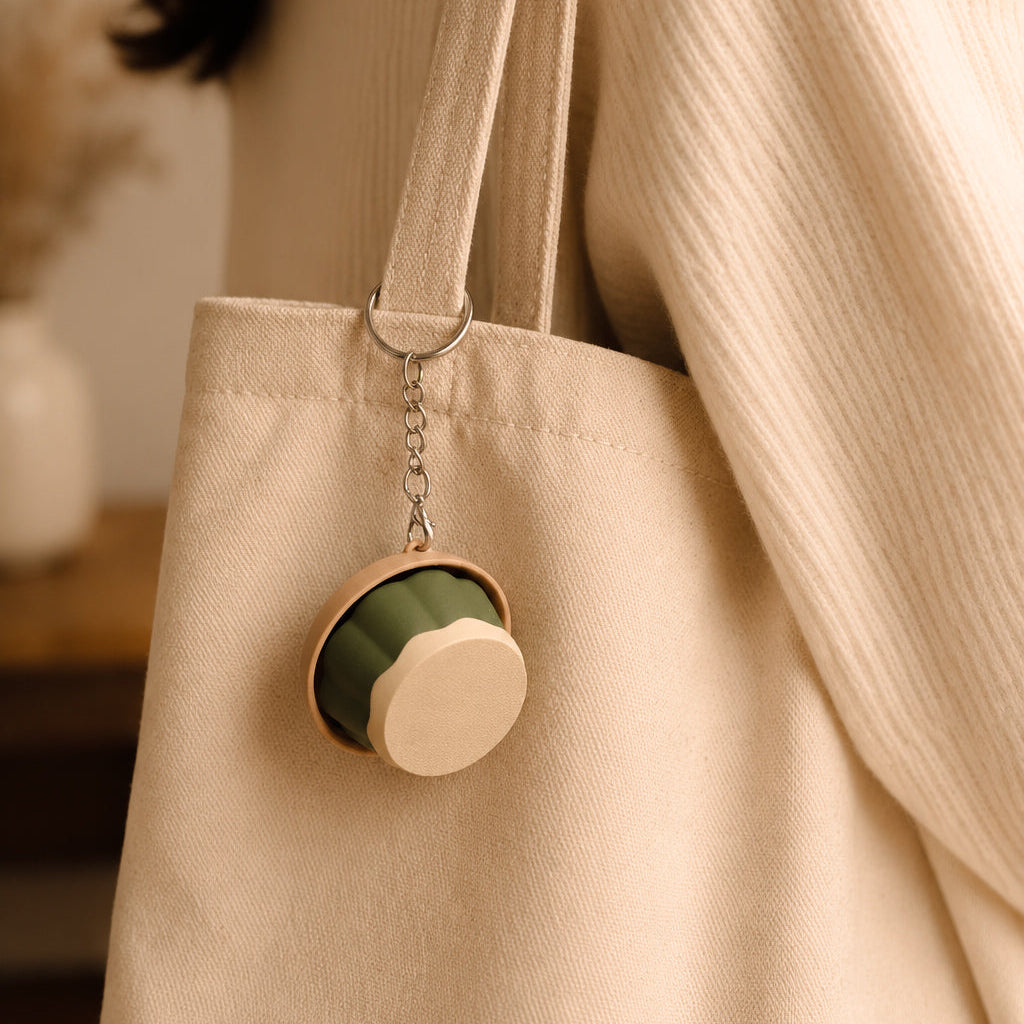 Kuma Labs Matcha Pudding Clicker — lifestyle photo on cozy desk