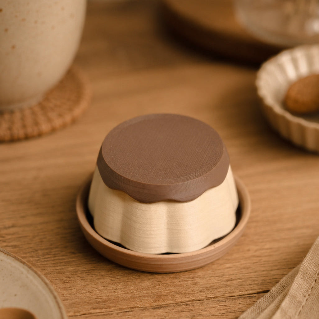 Pudding Clicker by Kuma Labs — styled flat lay