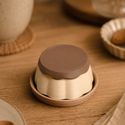 Pudding Clicker by Kuma Labs — styled flat lay