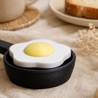 Kuma Labs Fried Egg Clicker — side view showing rounded shape