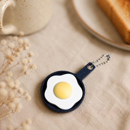 Kuma Labs Fried Egg Clicker — styled cozy photo