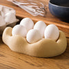 Morning Egg Nest by Kuma Labs — Desert Tan, styled on a kitchen countertop